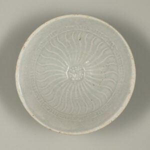 Bowl with Molded Flower at Center and Wavy Lines on Inside