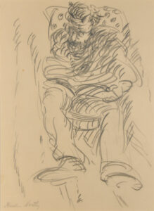 Man Seated in a Patterned Chair Reading