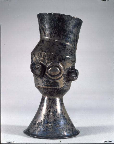 Beaker in the shape of a human head