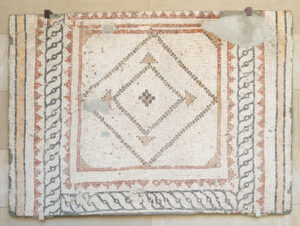 Fragment of floor mosaic depicting geometric designs