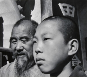 Chief Monk and Novice of a Buddhist Temple. Yunnan Province, China