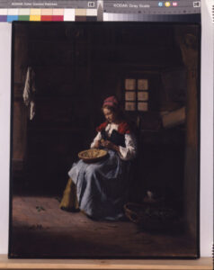 Woman Peeling Vegetables