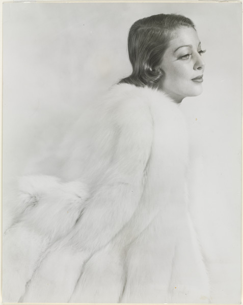 WOMAN IN A WHITE FUR COAT