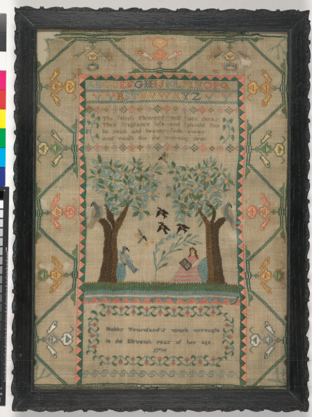 Sampler with figure in landscape