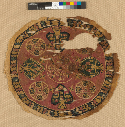 FRAGMENT OF ROUNDEL (ORBICULUS) WITH TREE OF LIFE MOTIFS