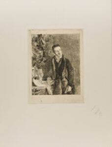 Portrait of a man with hand resting on some papers on a table