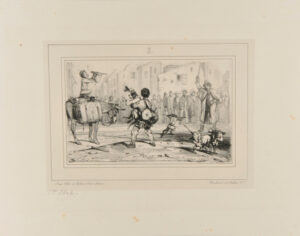 Travelling performer with monkeys and dogs in a town center