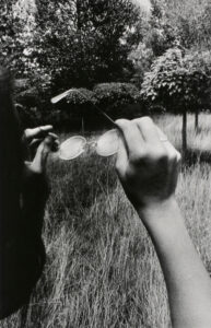 Girl Holding Glasses