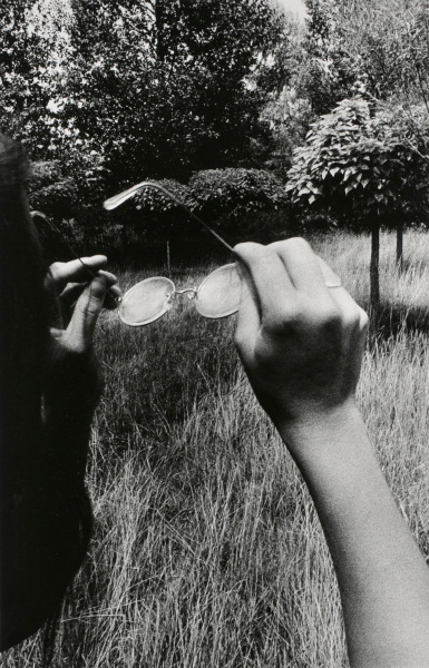 Girl Holding Glasses