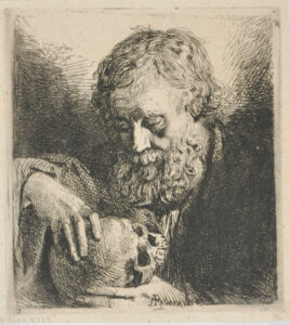 Bust of a bearded man contemplating a skull