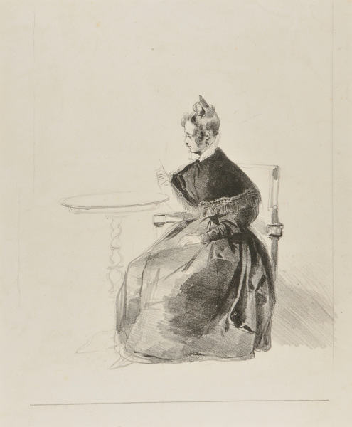 WOMAN SEATED AT A TABLE