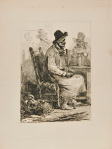 Seated man with cane