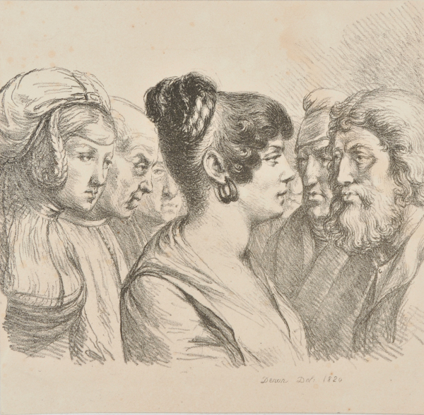 Woman seen from the right standing among a group of men with another woman behind her.