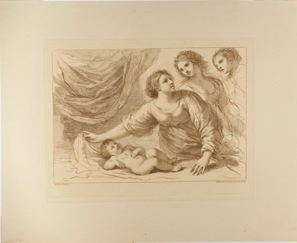 Three women, with a child lying on a couch