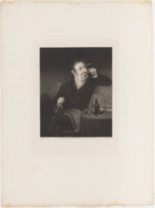 Man at Table Holding Glass of Wine to Light