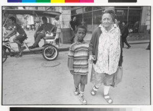 Old Woman and Boy Crossing Street