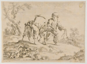 Two boys playing with a goat