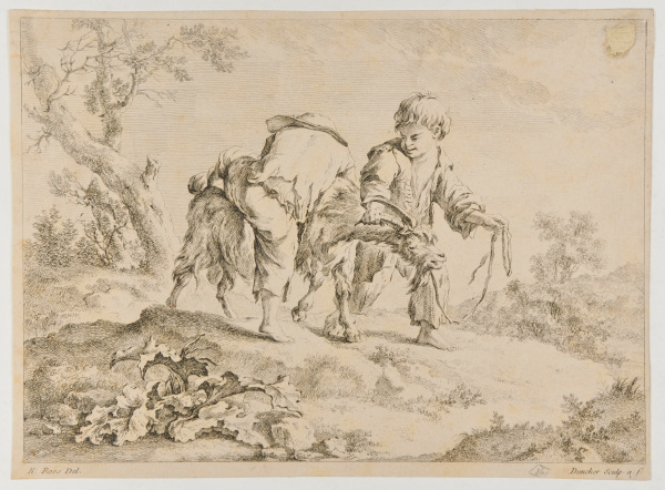 Two boys playing with a goat