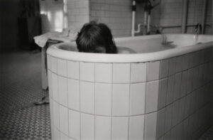 Mary Frances Peeking from Tub, Ward 81, Oregon State Hospital, Salem, Oregon