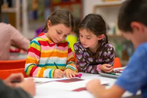 Children drawing at a table