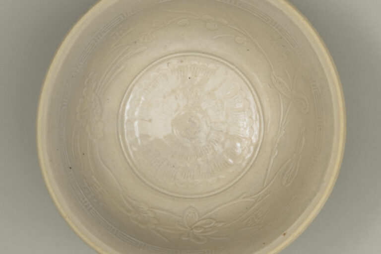 Bowl with Stamped Flower and Slip-Trailed Characters