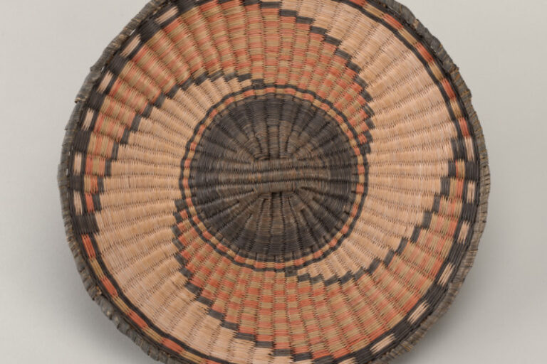 Plaque with whirlwind design