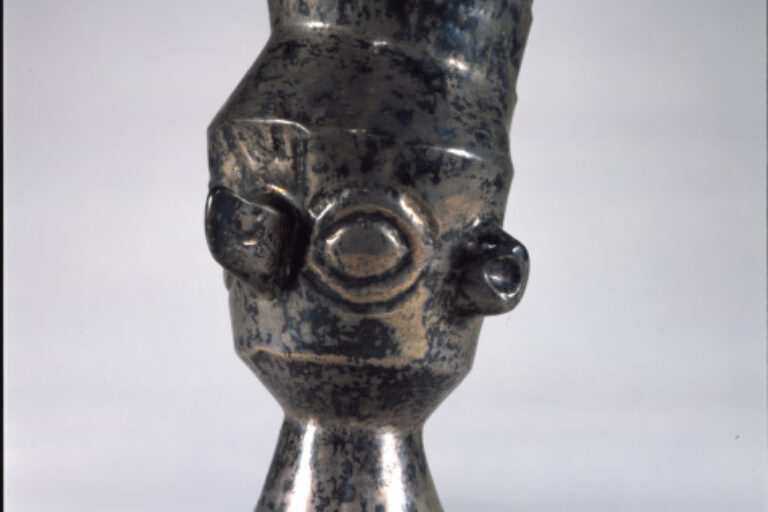 Beaker in the shape of a human head