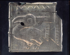 Plaque depicting a bird