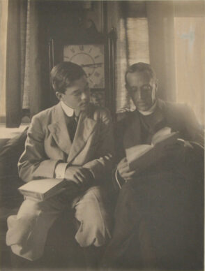 Man and Boy in Front of Clock