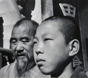 Chief Monk and Novice of a Buddhist Temple. Yunnan Province, China