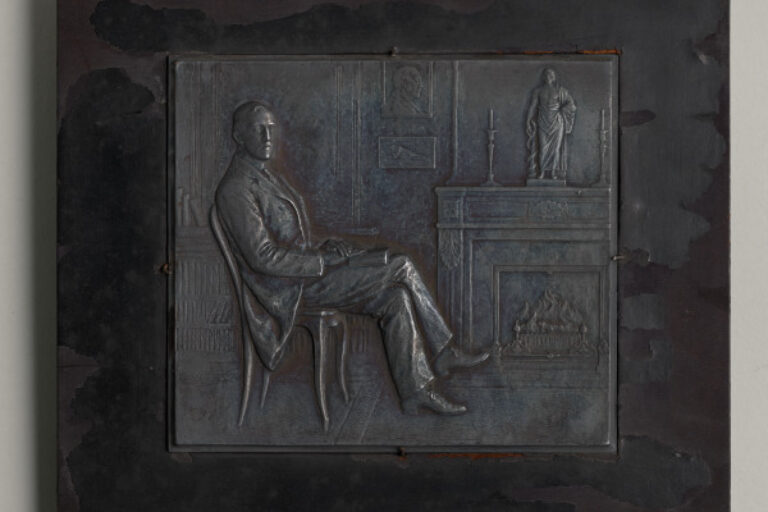 "SCENE OF A MAN SEATED BEFORE A FIREPLACE" PLAQUETTE