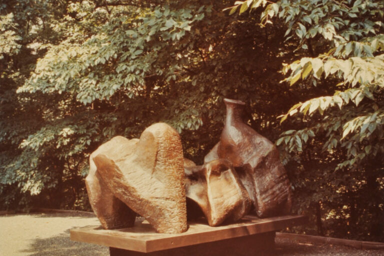 HENI MOORE, THREE PIECE RECLINING FIGURE. PHOTOGRAPH TAKEN IN THE WURTZBURGER SCULPTURE GARDEN (ORIGINAL SITE, TIMBERLANE)