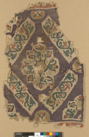 Fragment of a Decorative Band with Floral Medallion in Diamond Grid