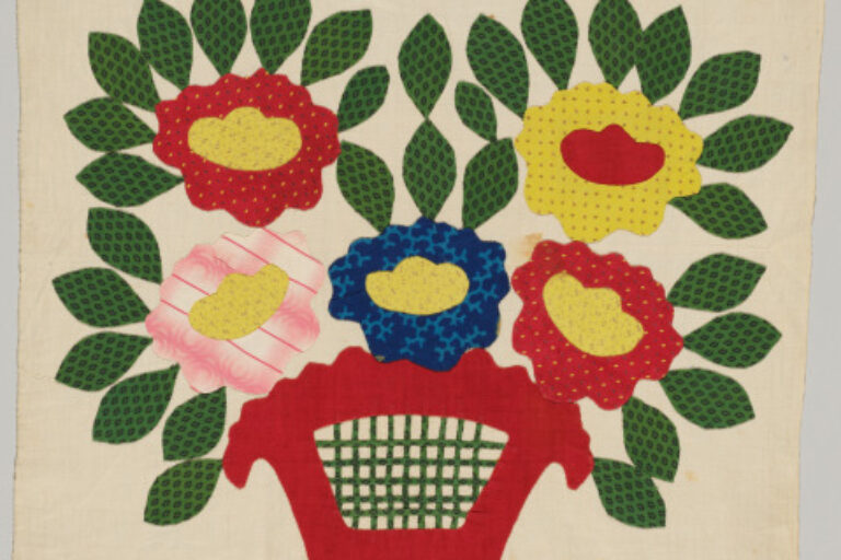 LARGE FLOWERS IN RED POT WITH GREEN LATTICE CENTER