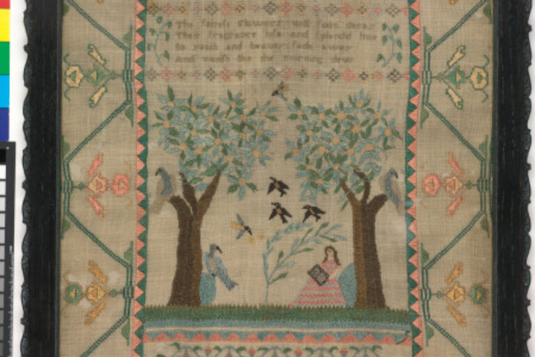 Sampler with figure in landscape