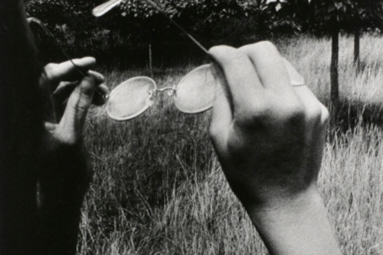 GIRL HOLDING GLASSES