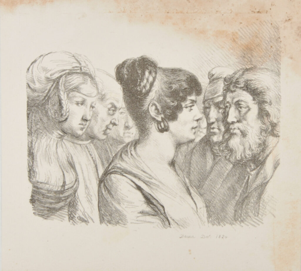 Woman seen from the right, standing among a group of men with another woman behind her.