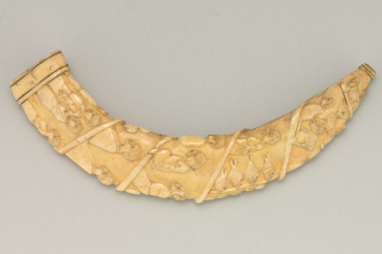 Tusk Carved in Relief