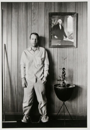 Inmate outside warden’s office, about to be transferred by local authorities, Ellis