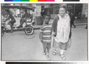 Old Woman and Boy Crossing Street
