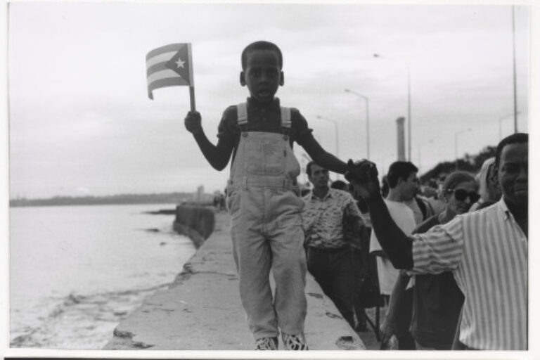 BOY WAVING FLAG