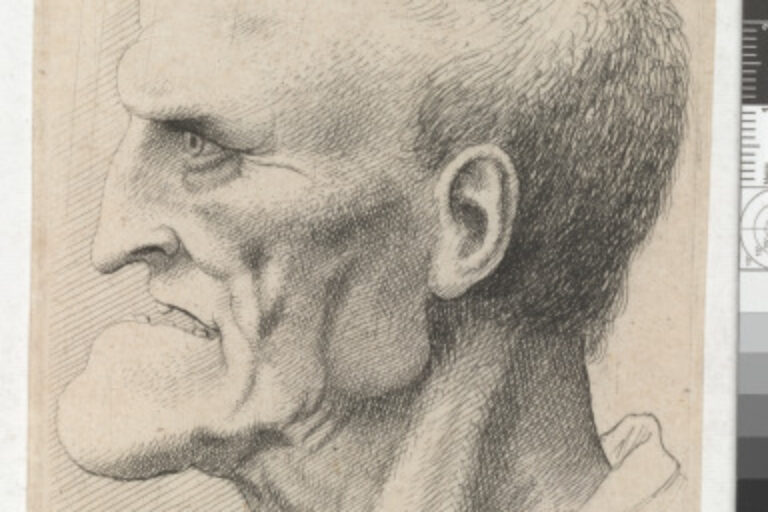 HEAD OF AN OLD MAN WITH PRONOUNCED CHIN, SHORT CROPPED HAIR AND GAPING MOUTH SHOWING TEETH IN PROFILE TO LEFT