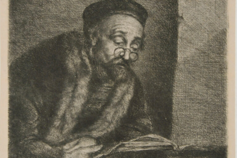 MAN WITH SPECTACLES READING A BOOK