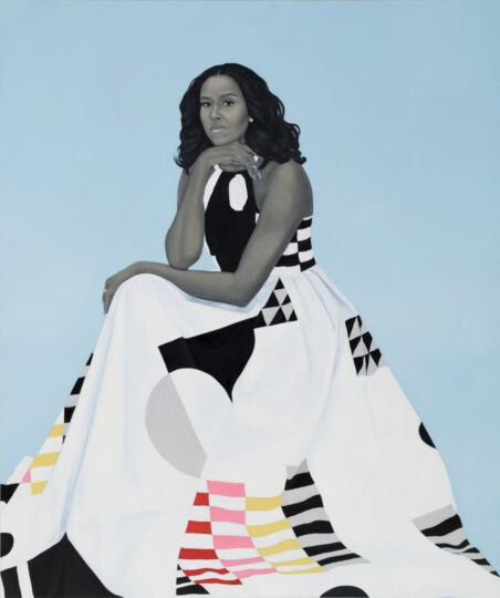 A portrait of Michelle Obama seated, looking forward, with her chin resting on her hand. She wears a dress with a black and white halter top and a full white skirt featuring geometric patterns in black, white, gray, pink, yellow, and red. The background is solid light blue.